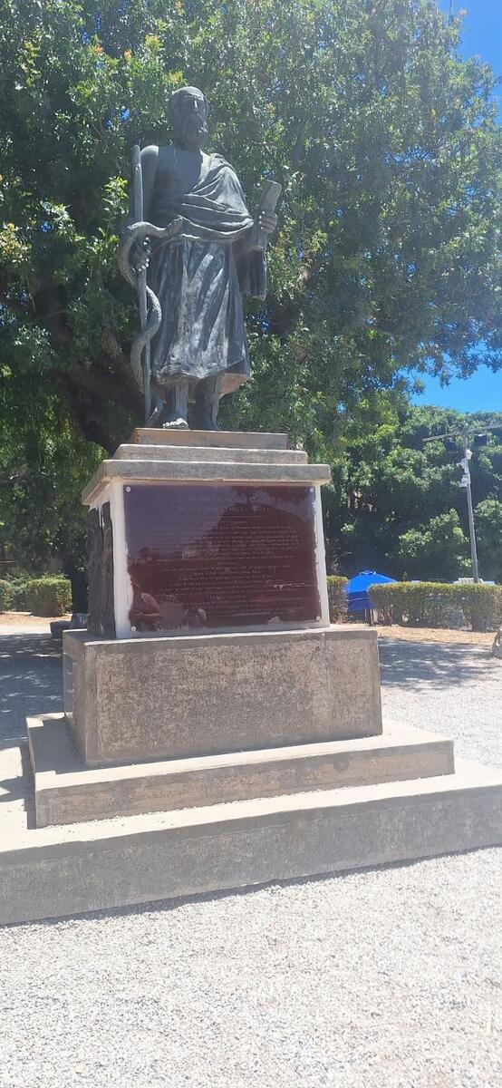 A statue beneath the trees in Kos